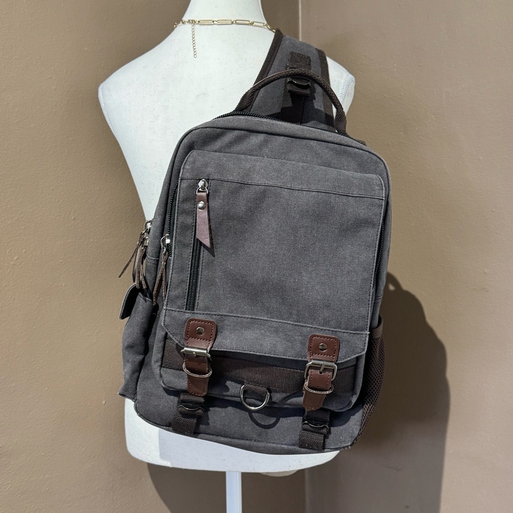 Gray Canvas Crossbody Backpack with Brown Accents Multiple Compartments Durable